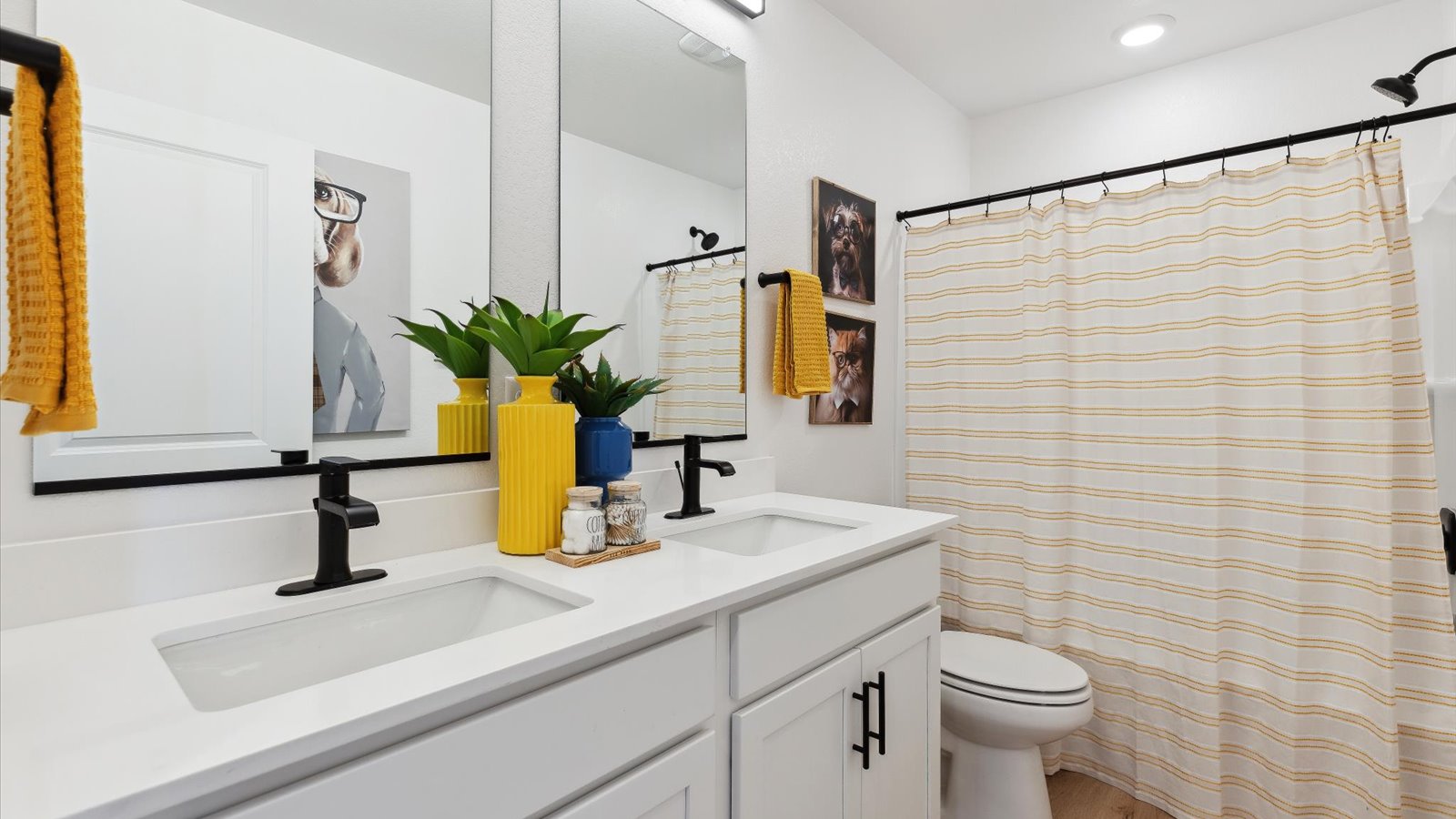 Secondary bathroom with dual vanity sinks in new D.R. Horton home in Colorado