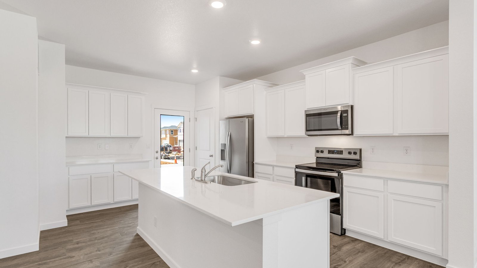 Spacious kitchen with premium cabinetry in new Elbert floor plan at Sky Ranch