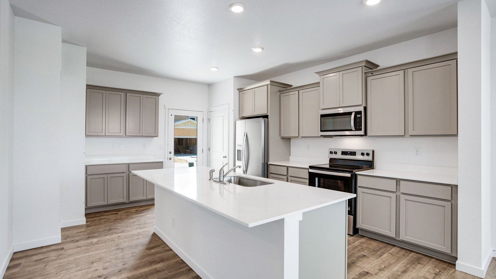 Spacious kitchen with new finishes in home at Sky Ranch Community