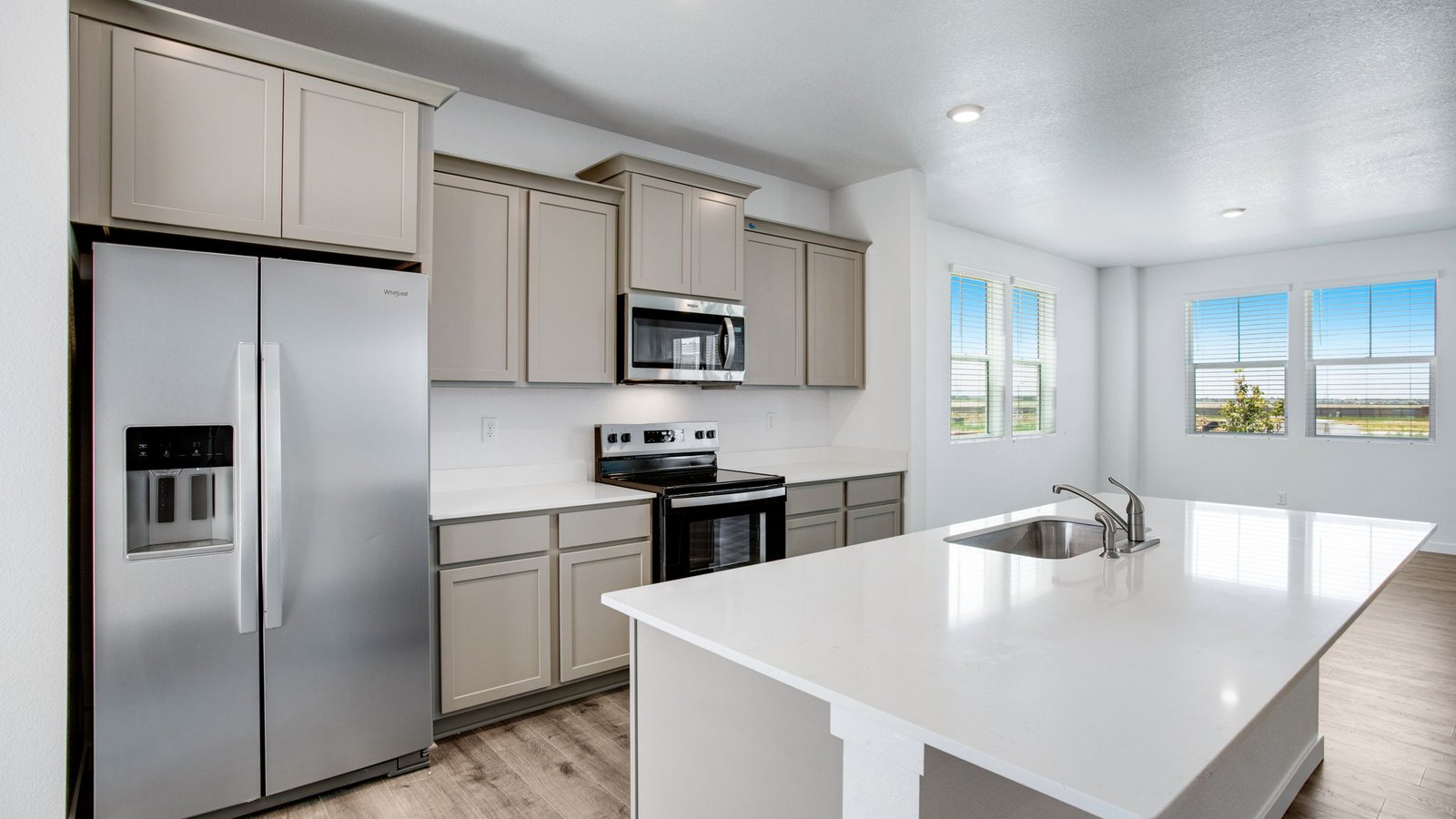 Spacious kitchen island perfect for entertaining in new home at Sky Ranch Community