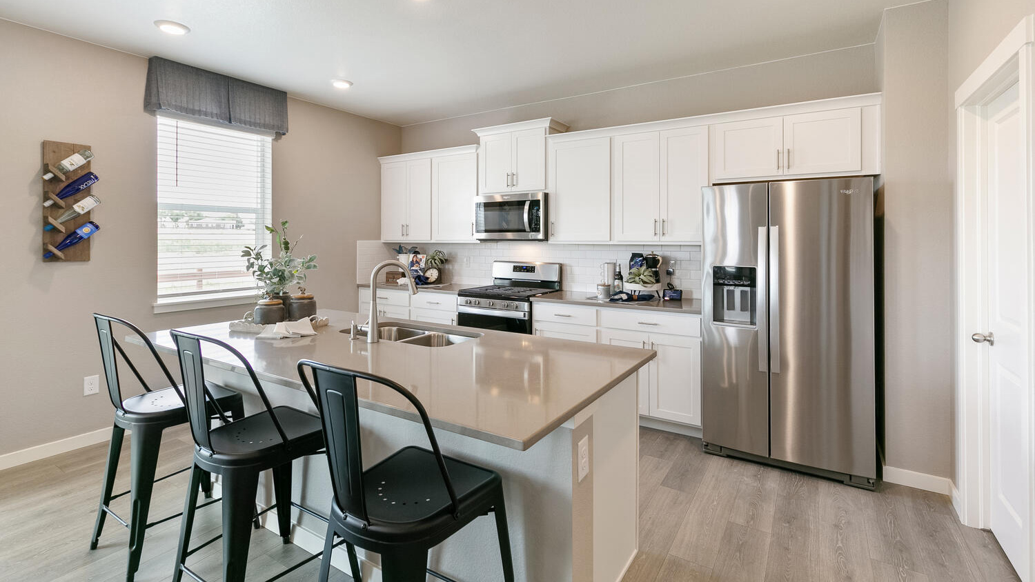 Kitchen with white cabinets in new construction home