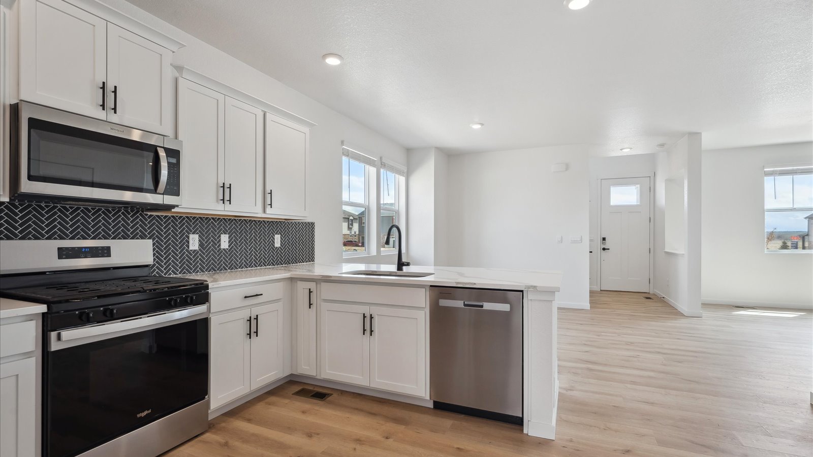 kitchen and dining room of new home in Aurora, CO