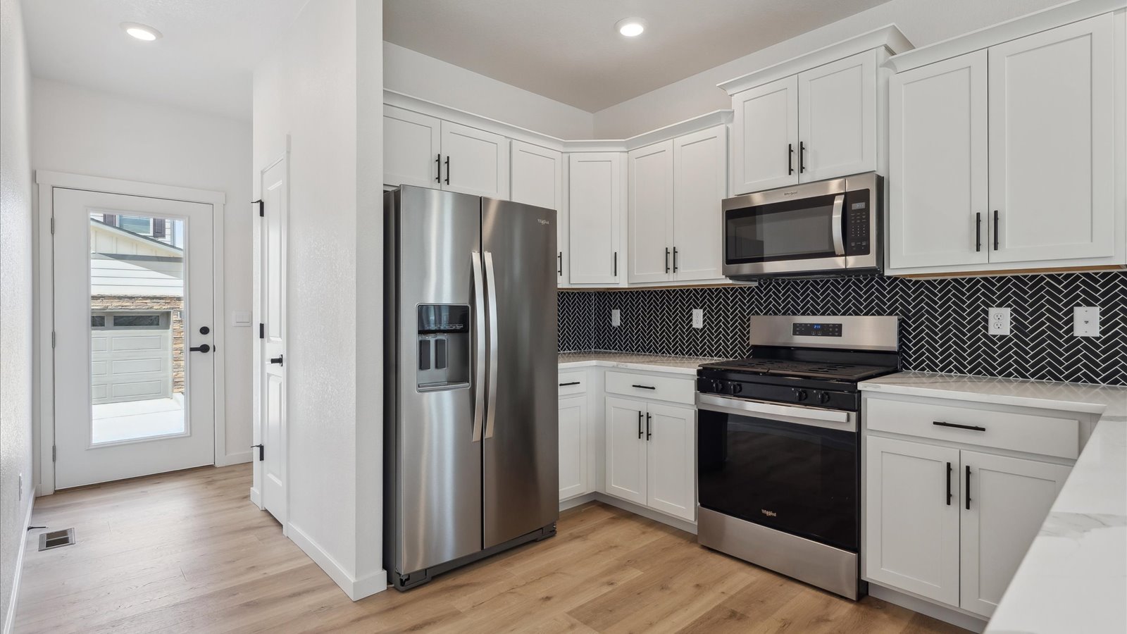 white cabinets and modern finishes in new construction home in Aurora, CO