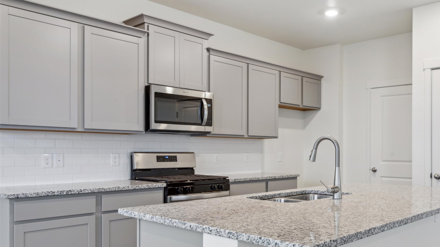 Spacious kitchen island in new home at Sky Ranch community
