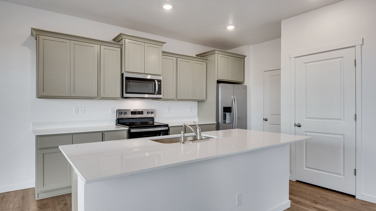 Spacious kitchen island in new home at Sky Ranch community in Colorado