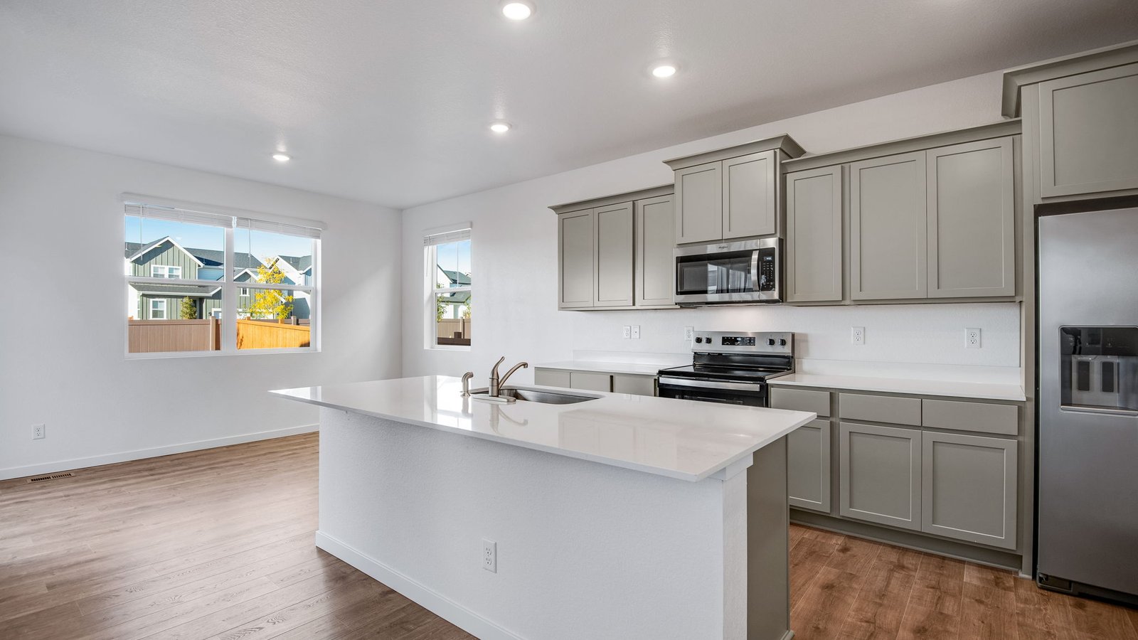 Kitchen with new finishes at new home community Sky Ranch