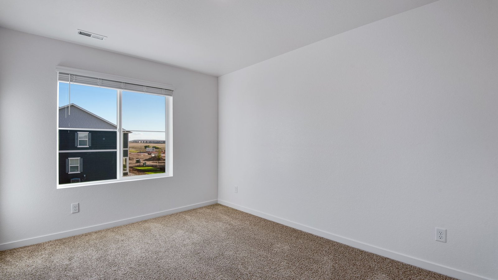 Secondary bedroom in new home in Watkins Colorado