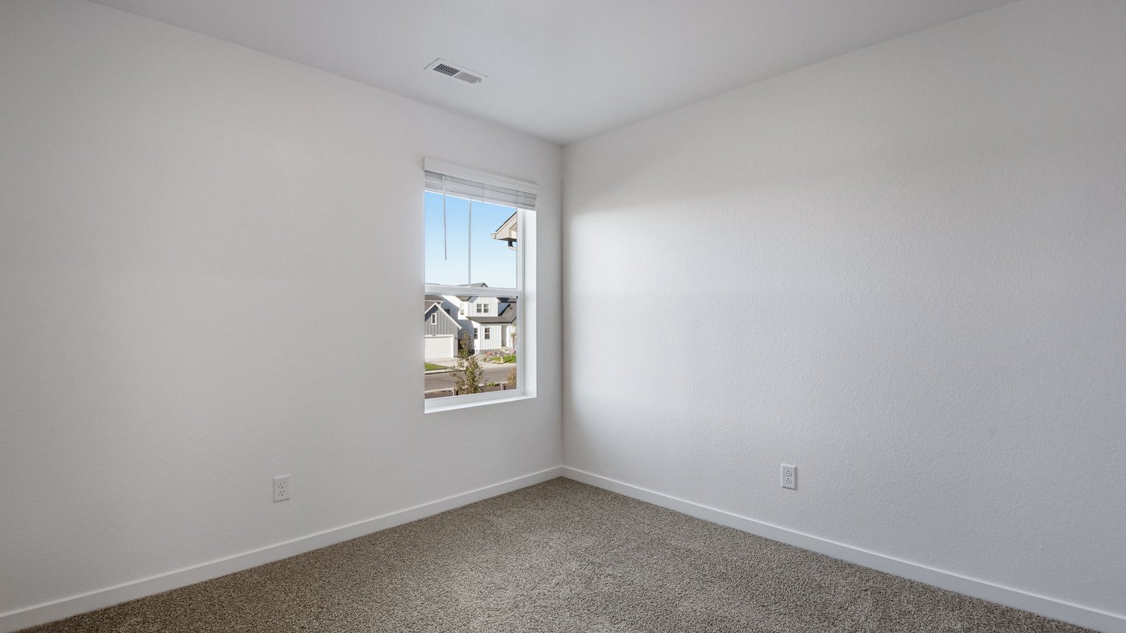 Secondary bedroom in new home in Watkins Colorado