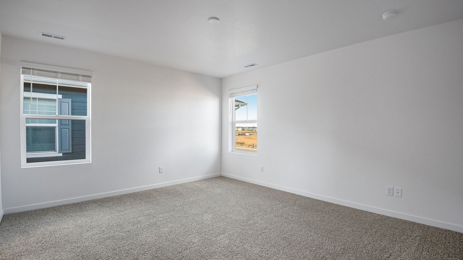 Spacious primary bedroom with new home in Sky Ranch community