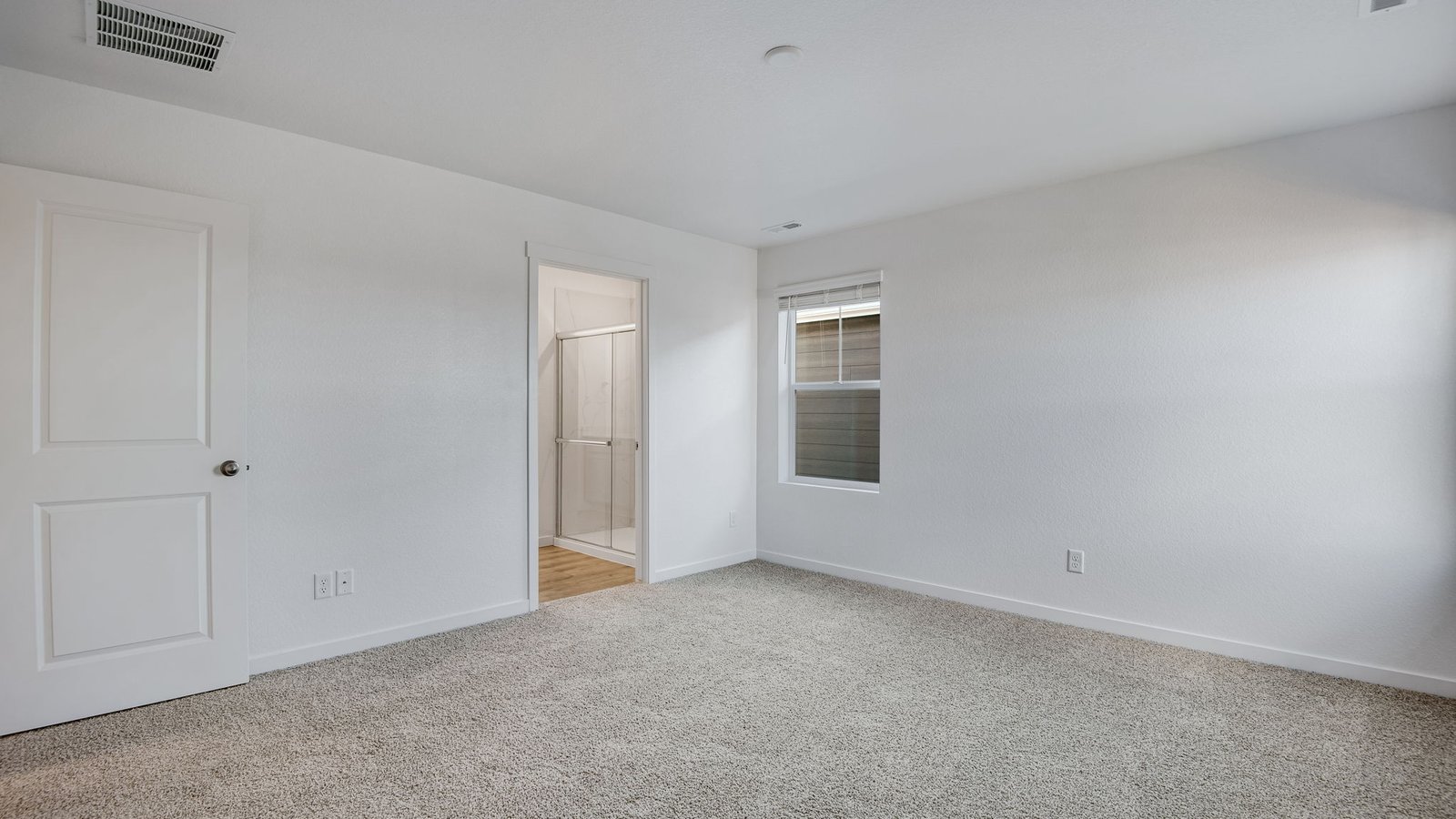 Spacious primary bedroom with new home in Sky Ranch community