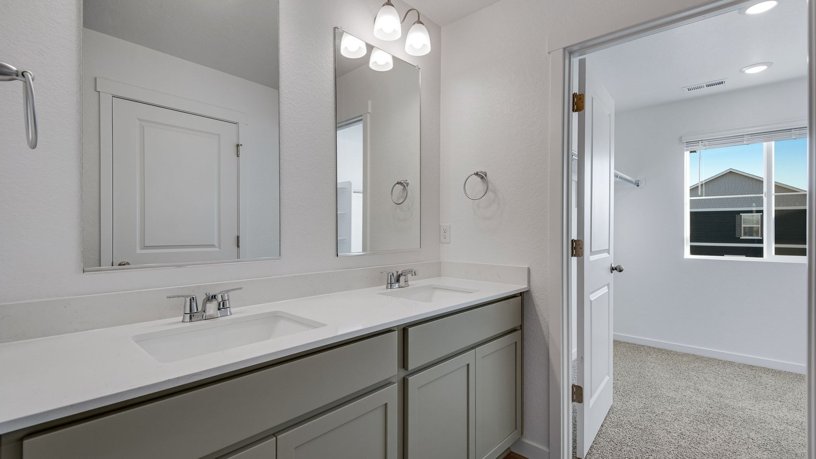 Attached private primary bathroom in new home in Watkins Colorado