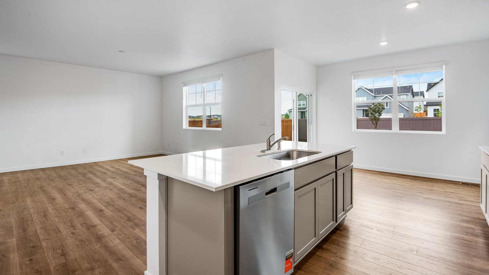 Spacious kitchen island looking out to living room open concept in Denver