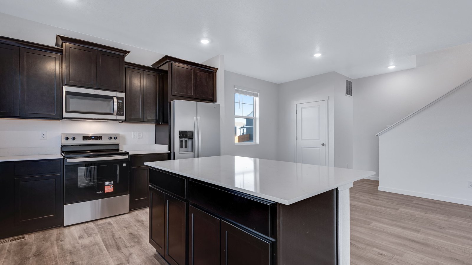 Kitchen island perfect for entertaining in new home in Watkins, Colorado