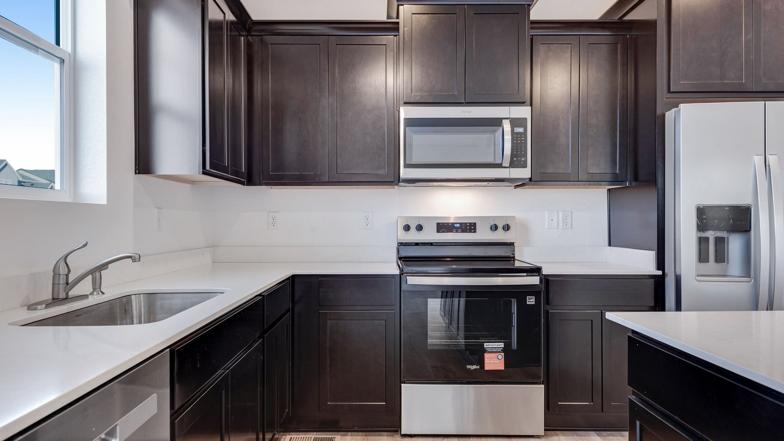 Home with new stainless steel appliances in new home in Watkins Colorado