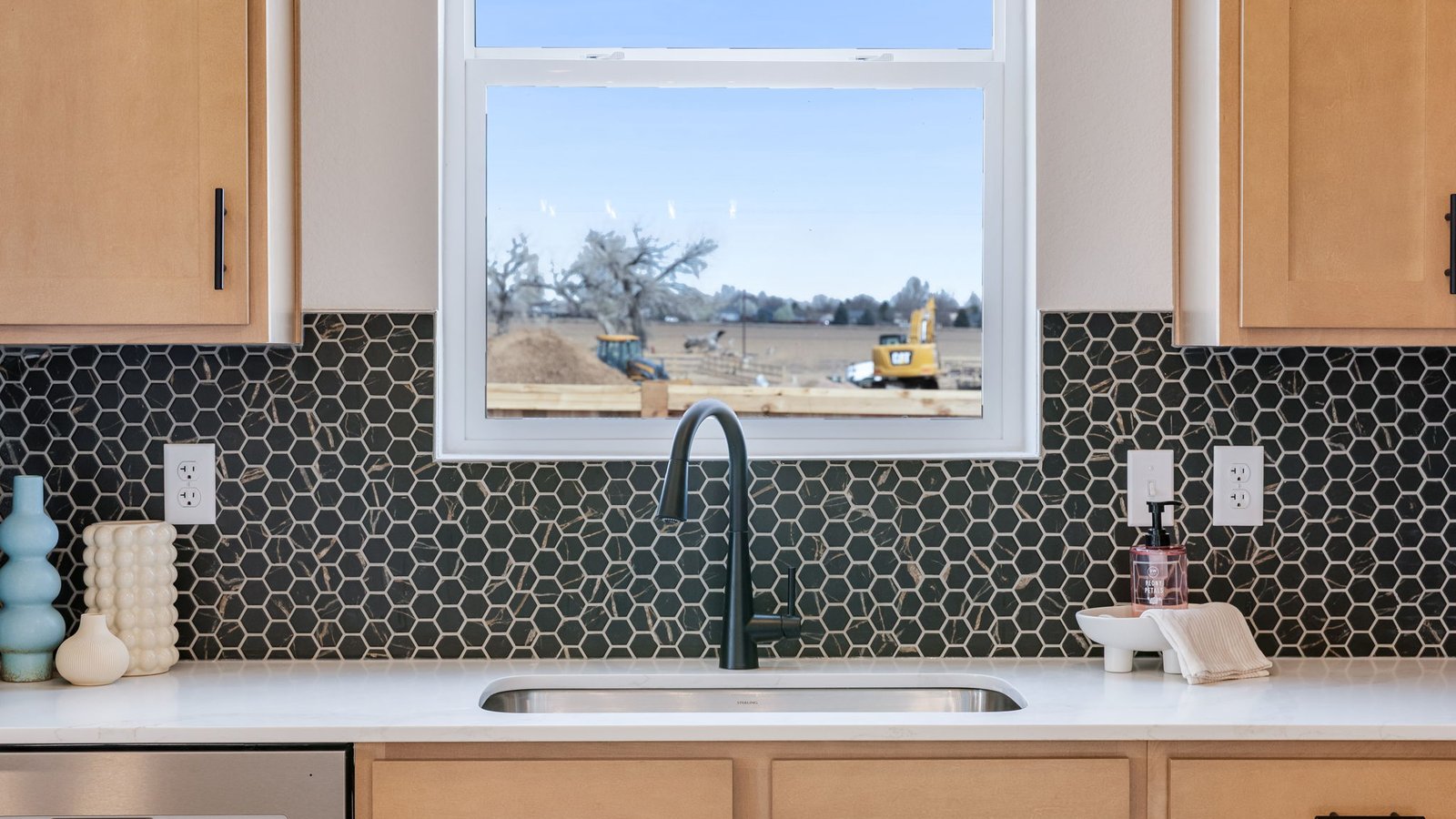 kitchen sink with black faucet in new d.r. horton home