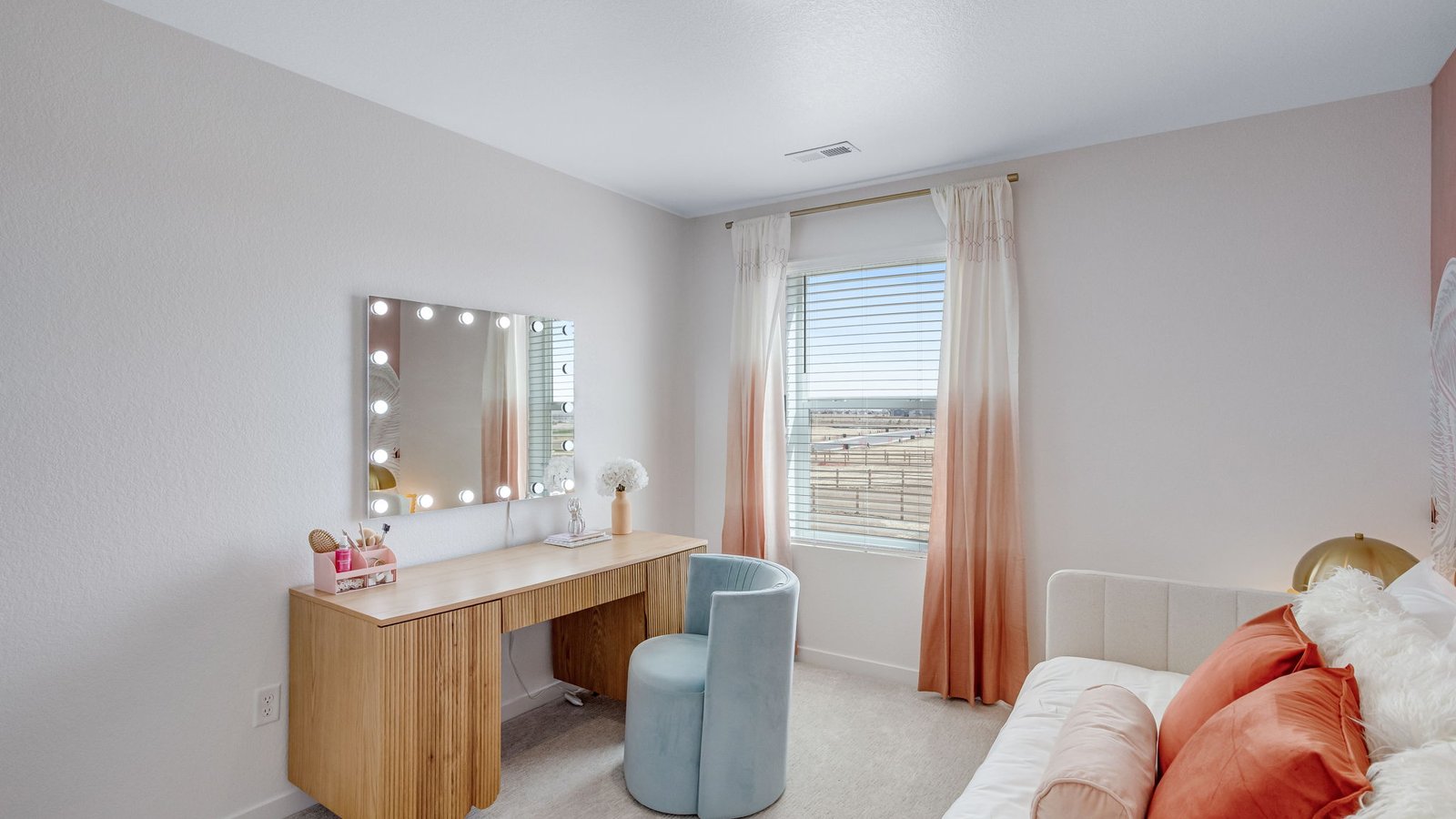 girls room with makeup area in model home by d.r. horton