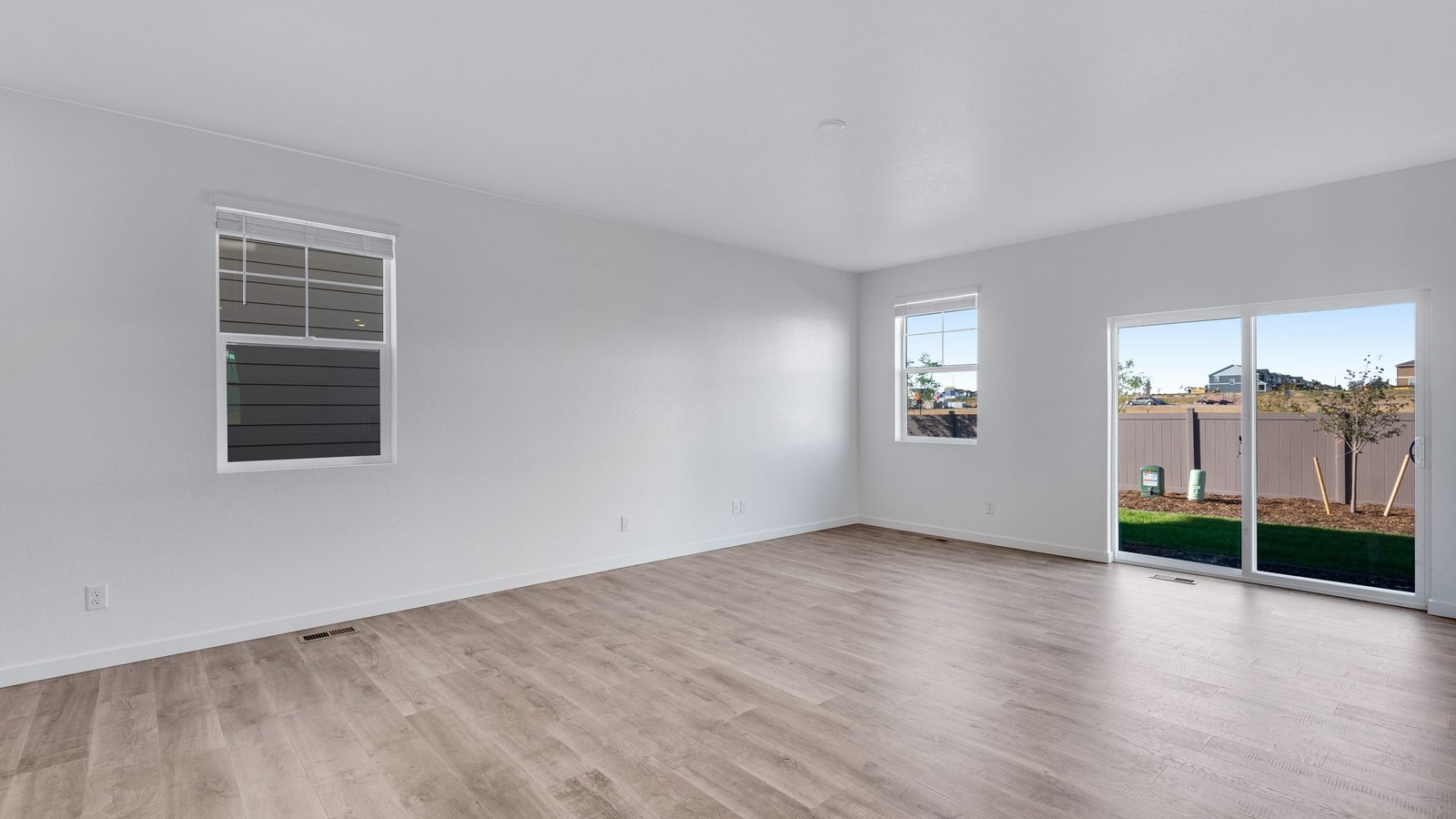 Living room space with natural light in new home in Watkins Colorado