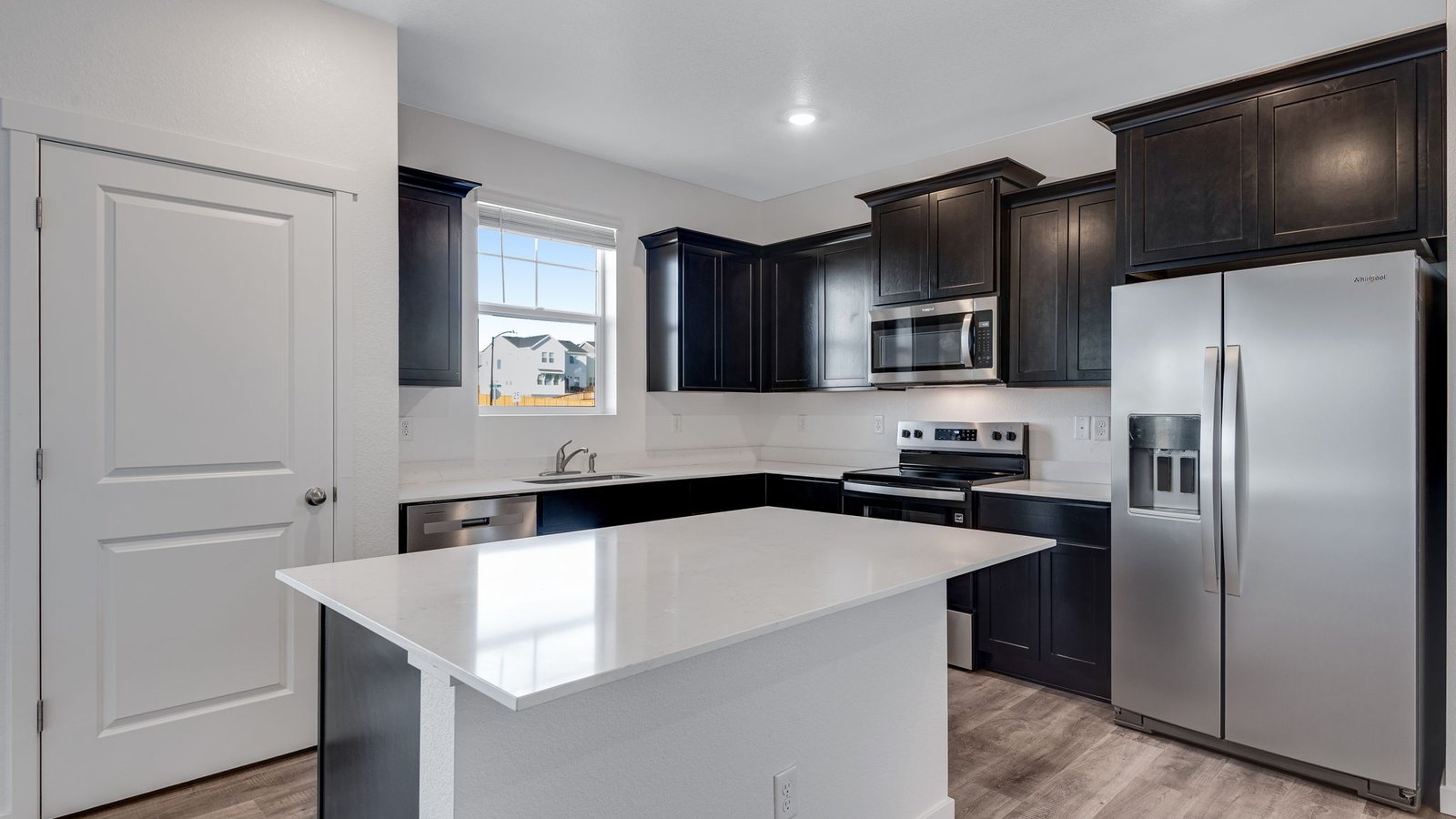 Spacious kitchen with new finishes in new D.R. Horton home at Sky Ranch Community