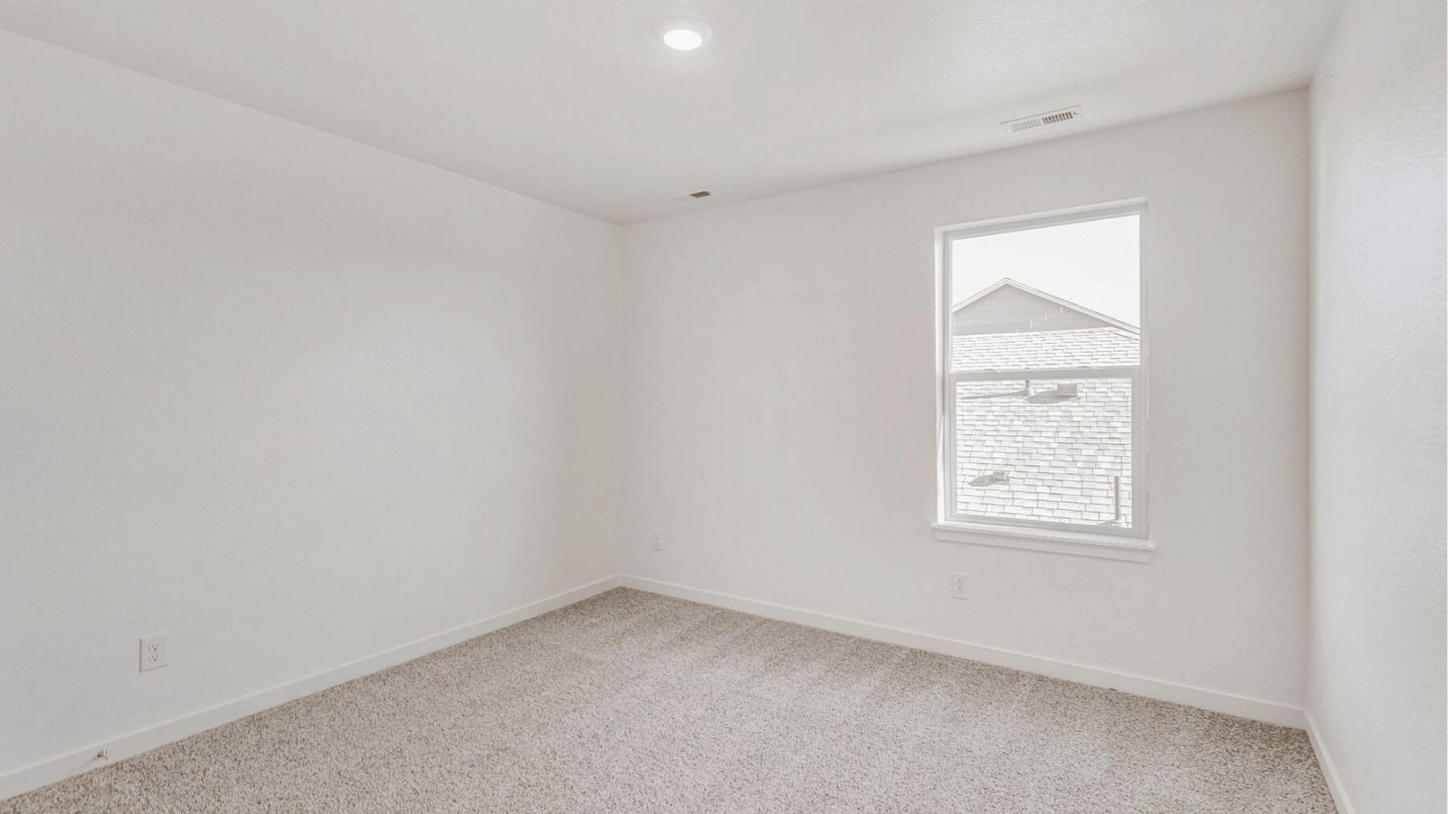Additional bedroom in the Elm floor plan at Sky Ranch with versatile living space