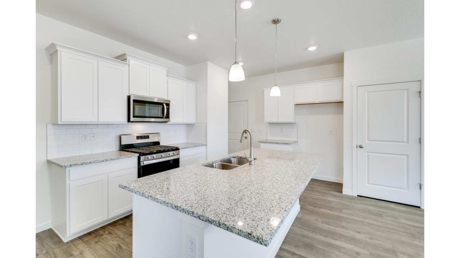 Spacious kitchen island perfect for entertaining in new home at Sky Ranch Community