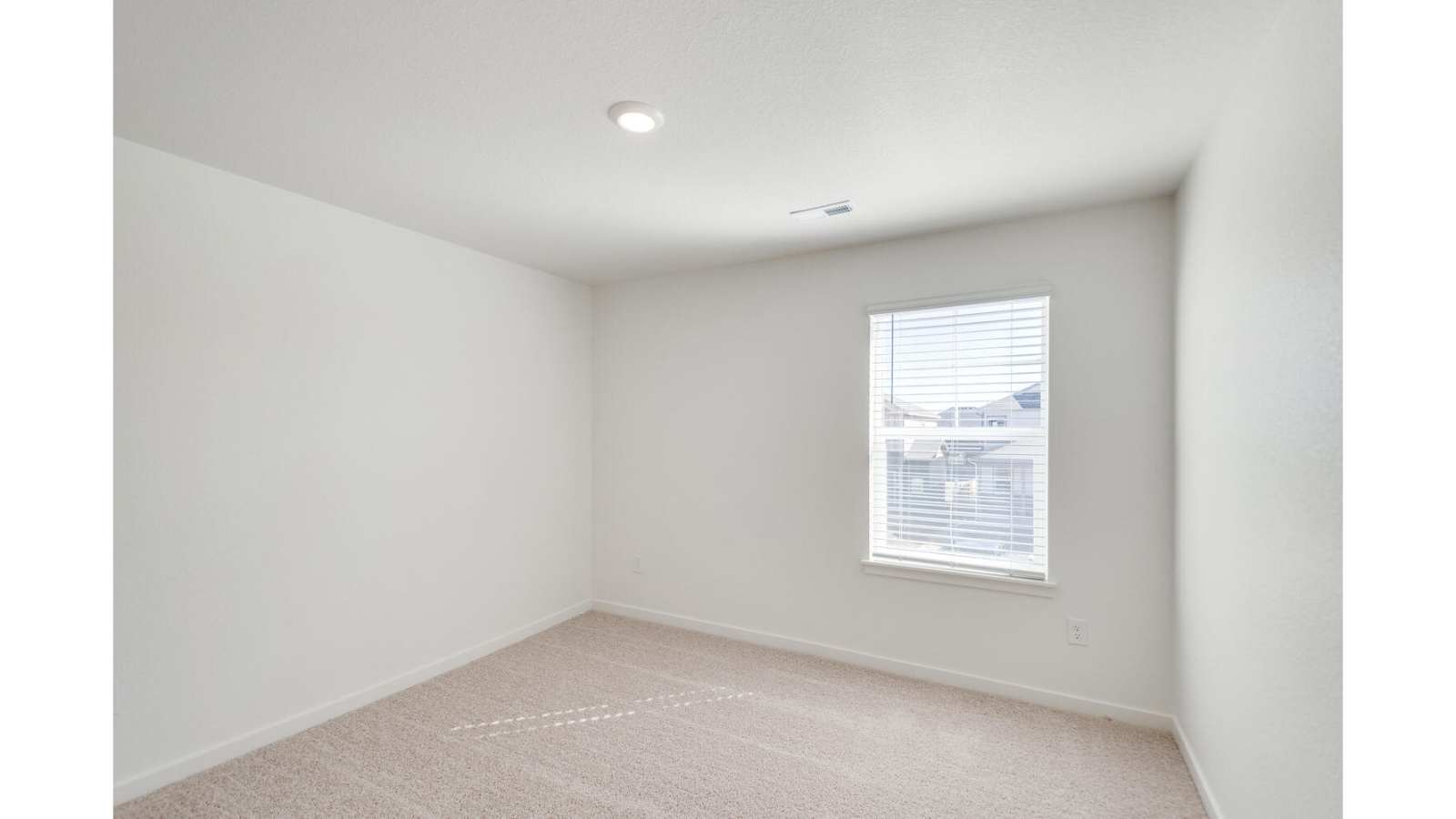 Secondary bedroom in new D.R. Horton home at Sky Ranch Community