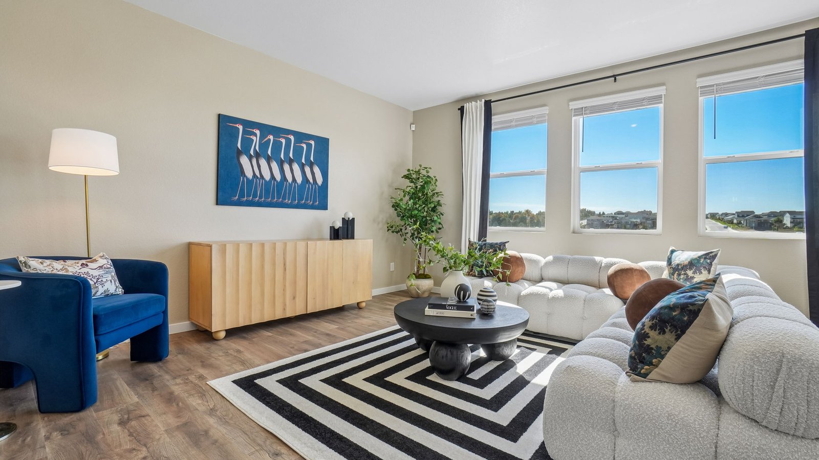 Living room with large windows in new home at Jackson Creek Community in Monument Colorado