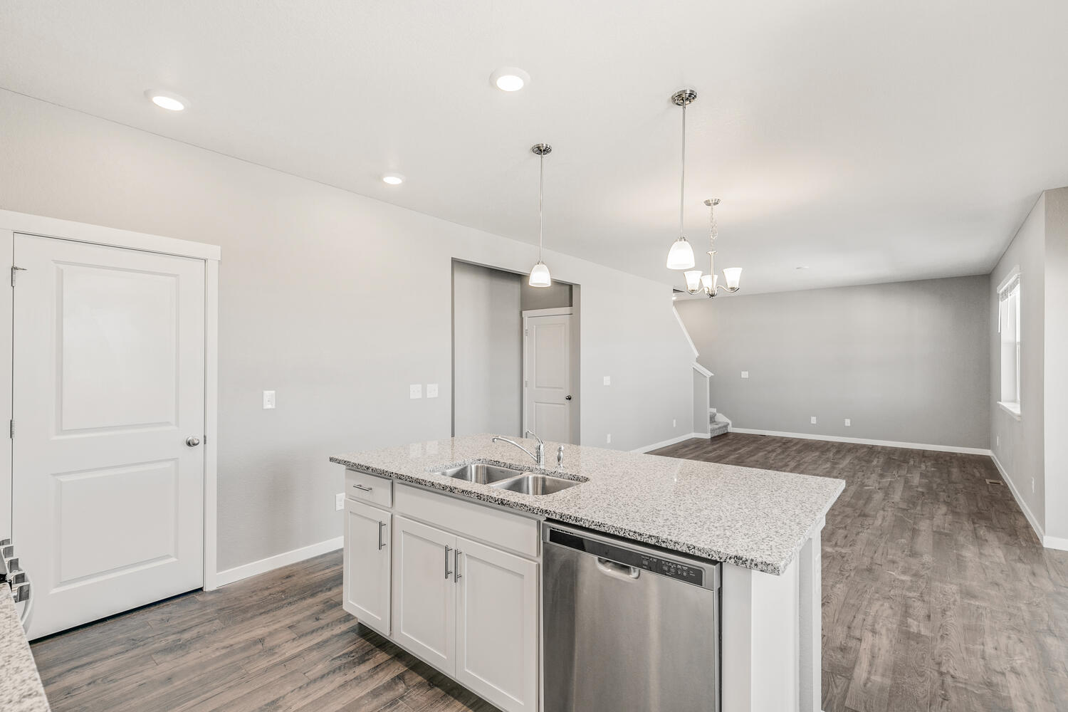 Kitchen island overlooking dining nook and great room of Pendleton plan