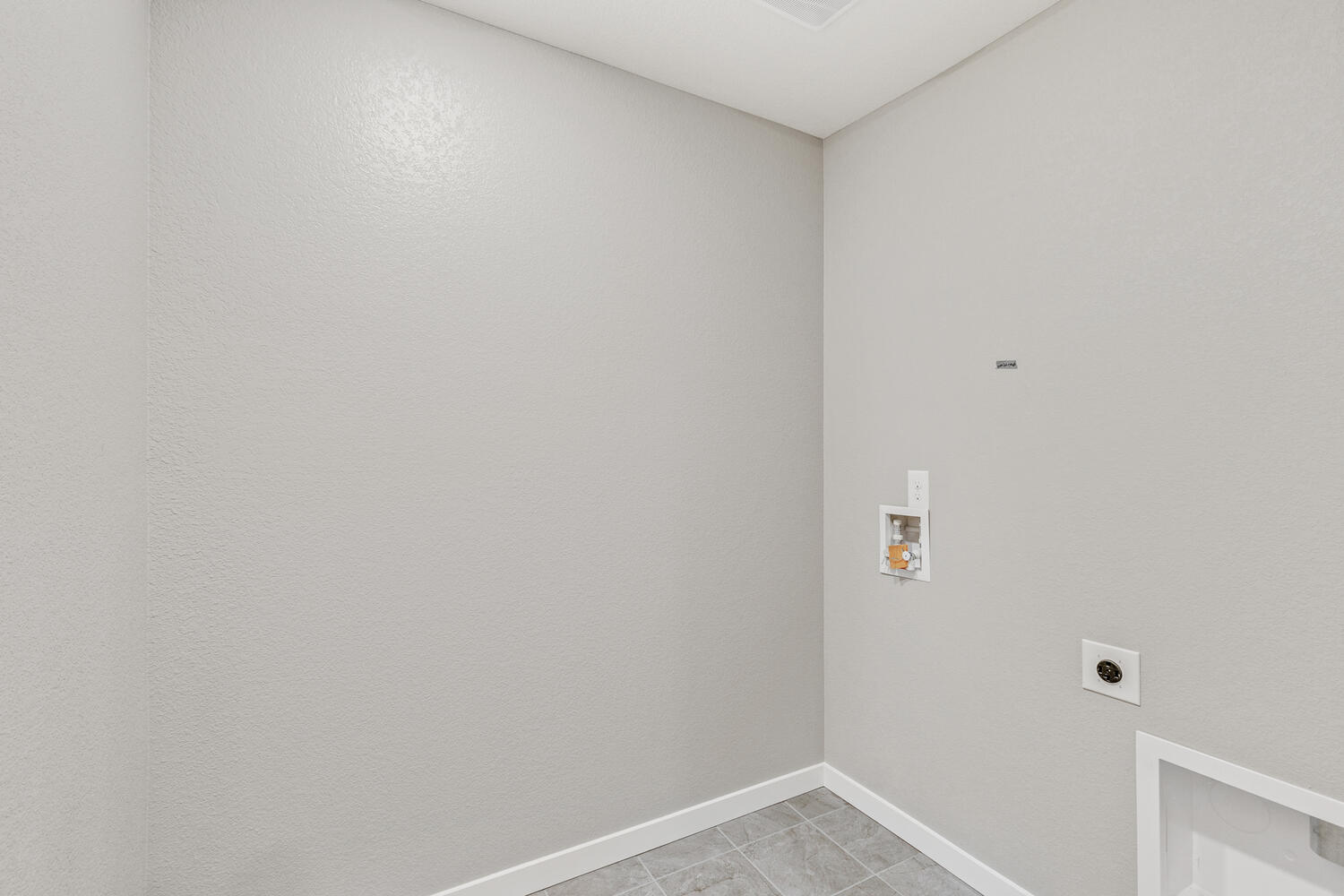 Pendleton model home laundry room with hook-ups for washer and dryer