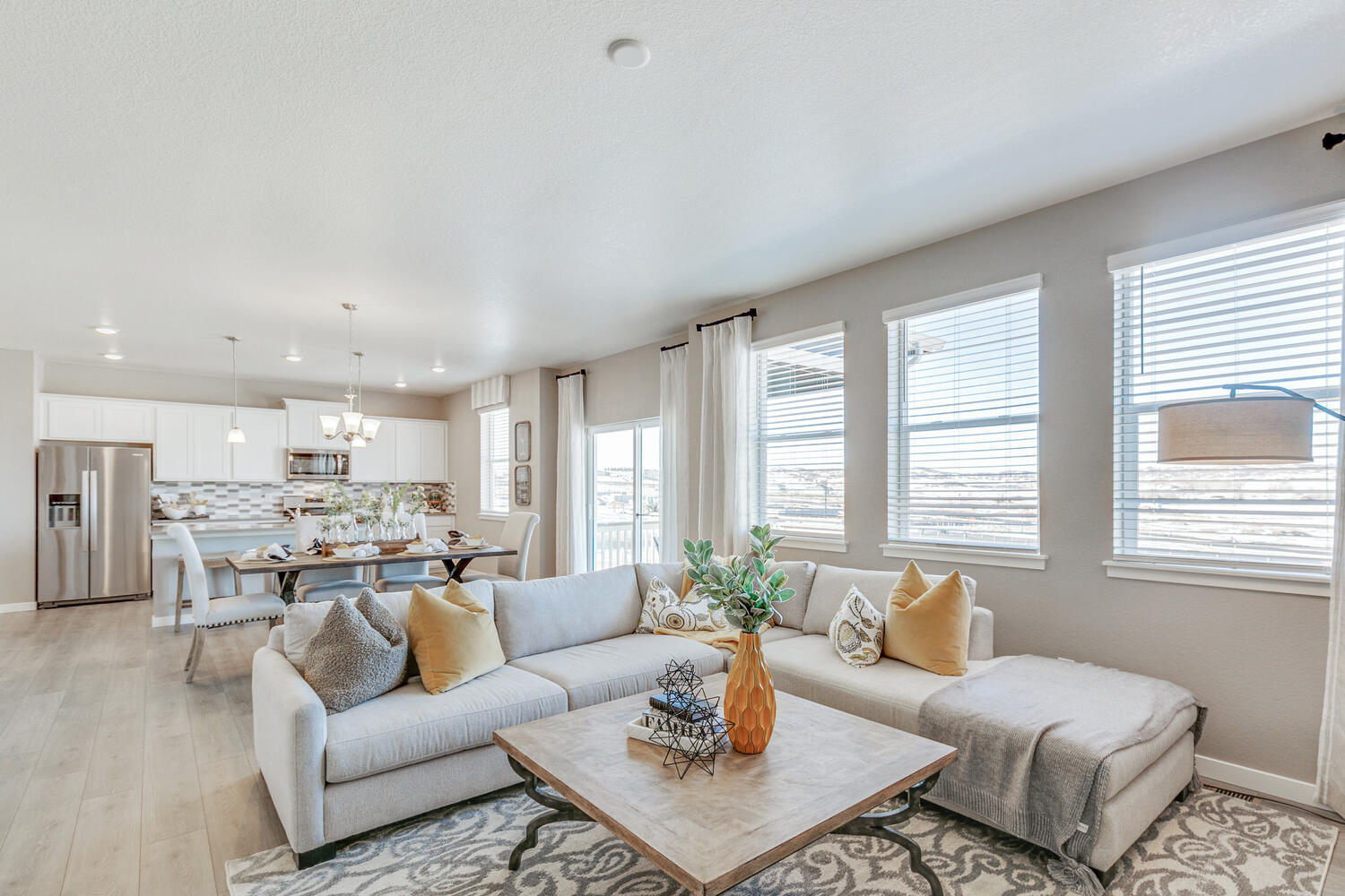 Open concept kitchen, dining and great room with ample sources of natural light