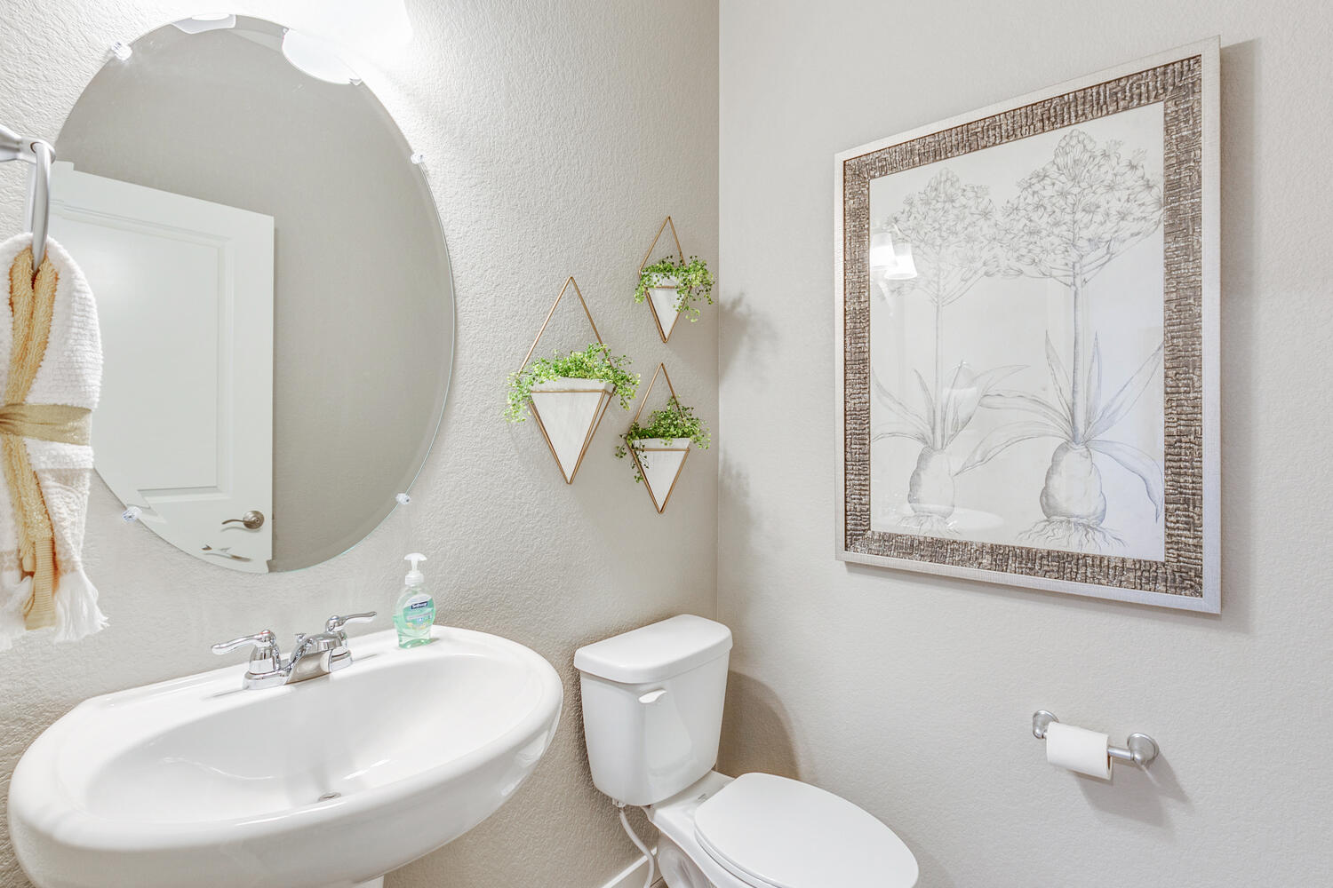 Powder room of Bridgeport plan featured at Trails at Crowfoot by D.R. Horton