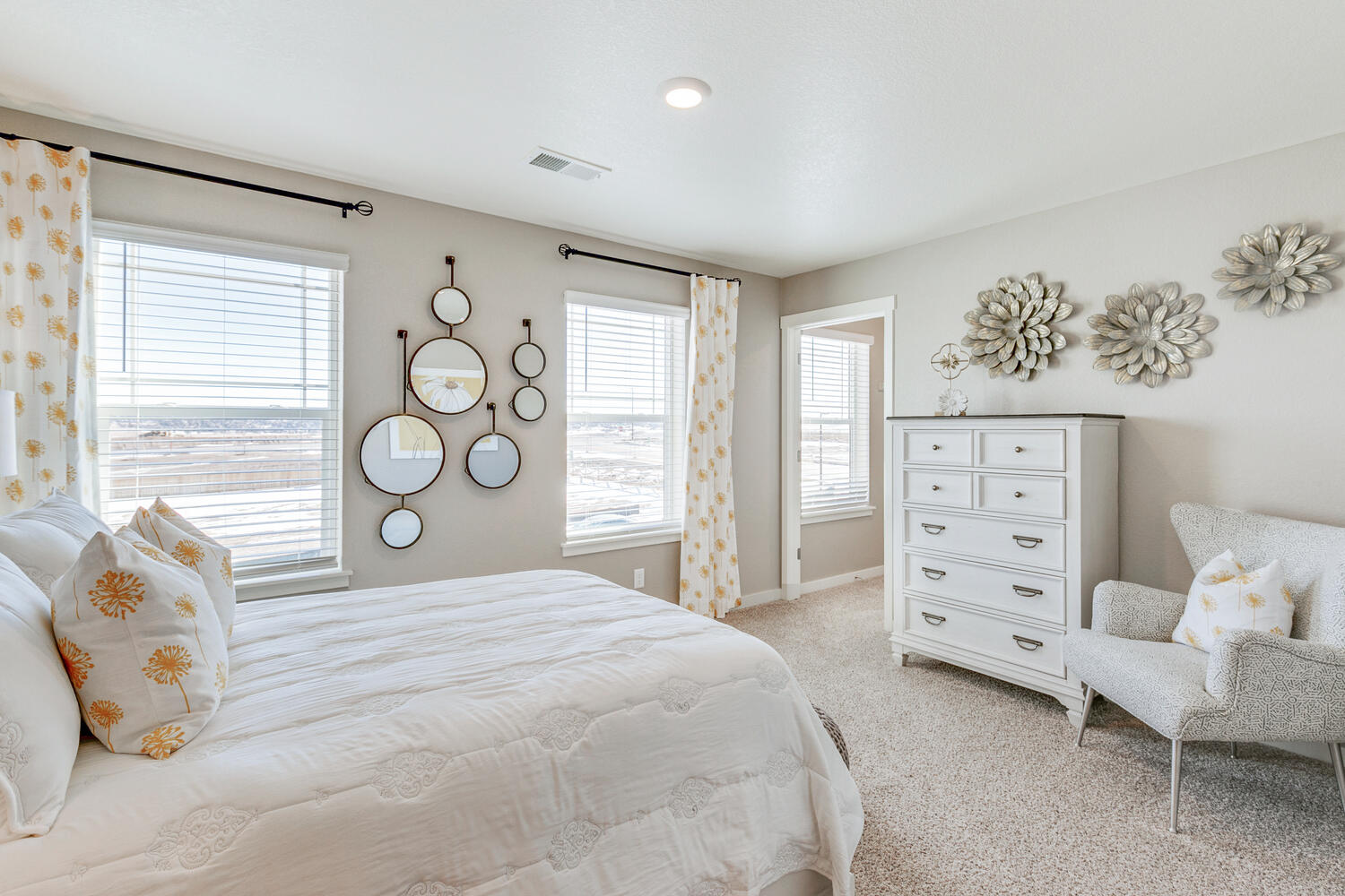 Bridgeport secondary bedroom with plush carpet and two windows