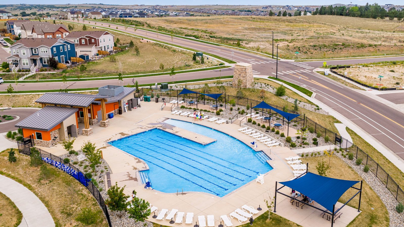 Aerial shot of Trails at Crowfoot amenities including playground, green space, basketball and tennis courts in Parker, CO