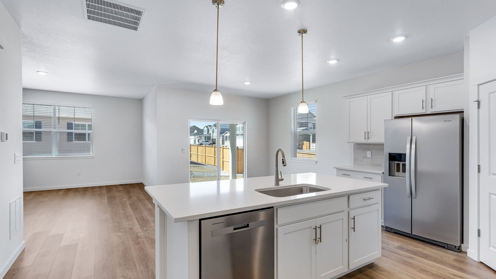 Spacious kitchen with island perfect for entertaining in new Parker Colorado home
