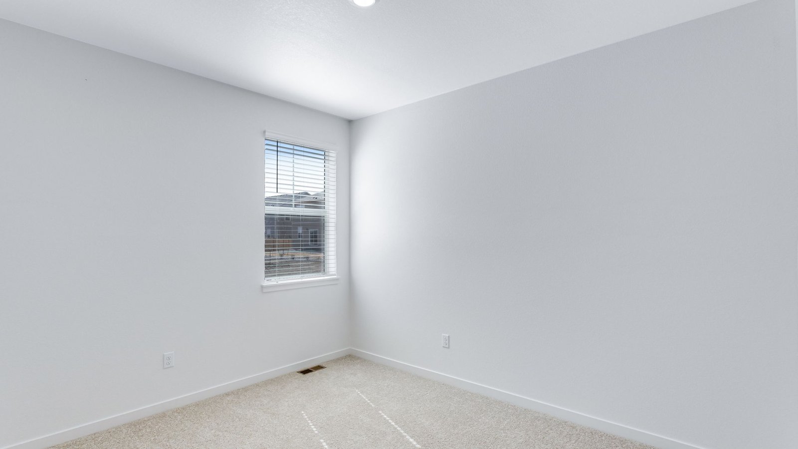 Secondary bedroom in new home at Trails at Crowfoot community in Parker Colorado