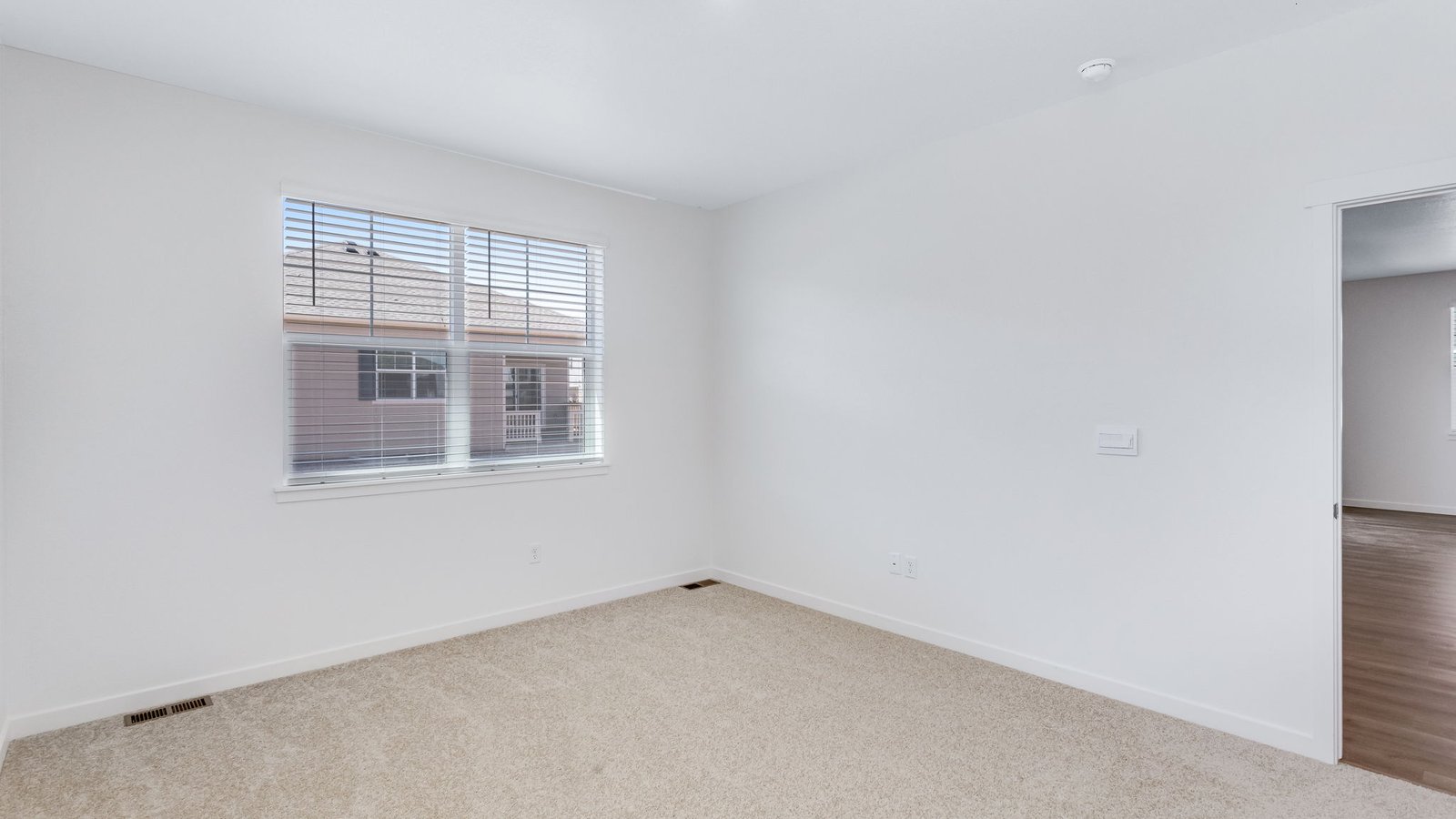 Spacious primary bedroom with new large windows in Parker Colorado