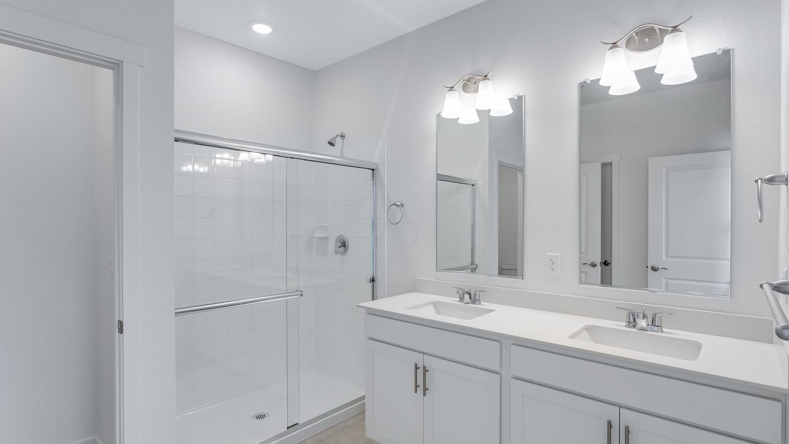 Secondary bathroom with dual vanity sinks in new home community in Parker Colorado