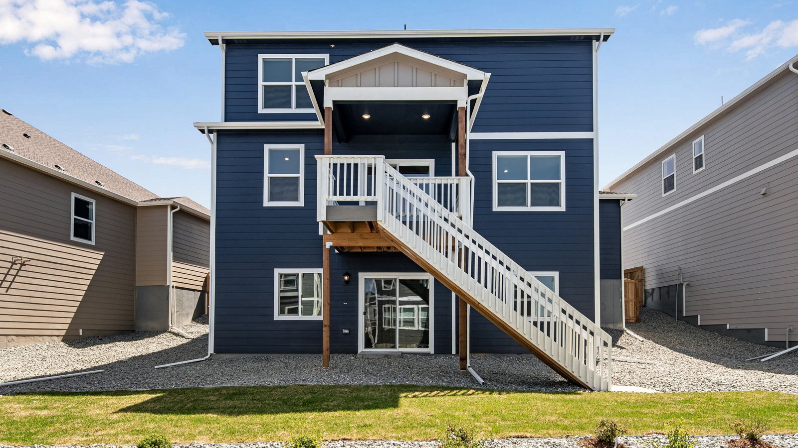 new home with backyard landscaping