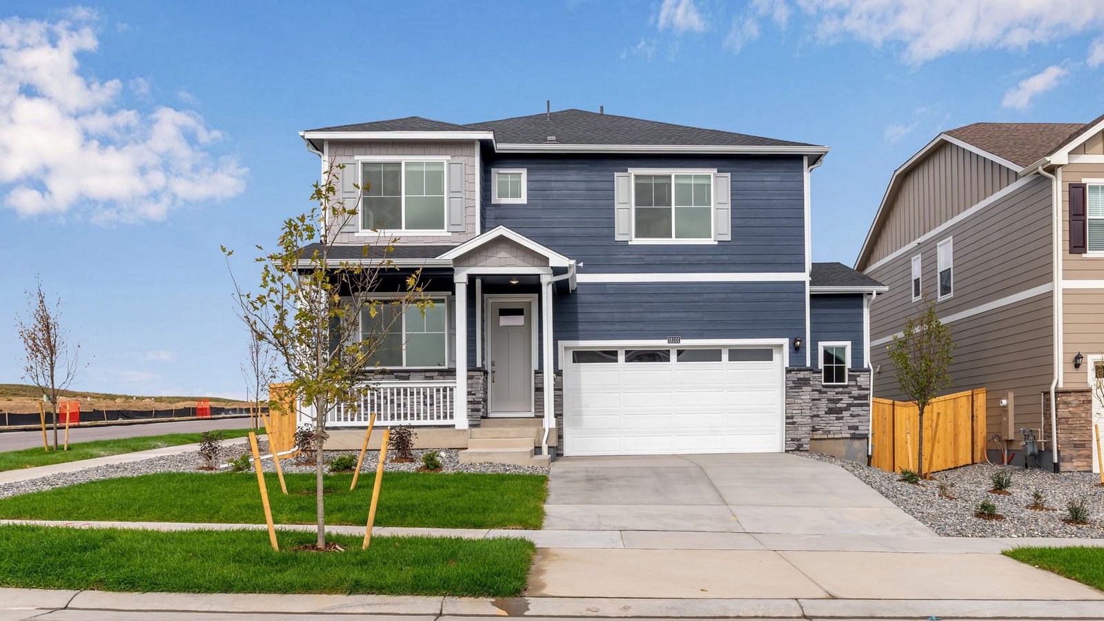 Exterior of two story Holcombe floor plan in new home in Parker Colorado