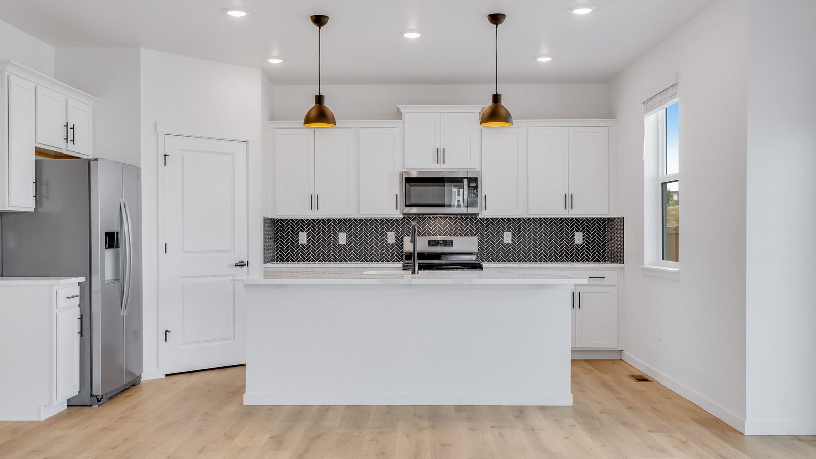Spacious kitchen with new finishes at Trails at Crowfoot community
