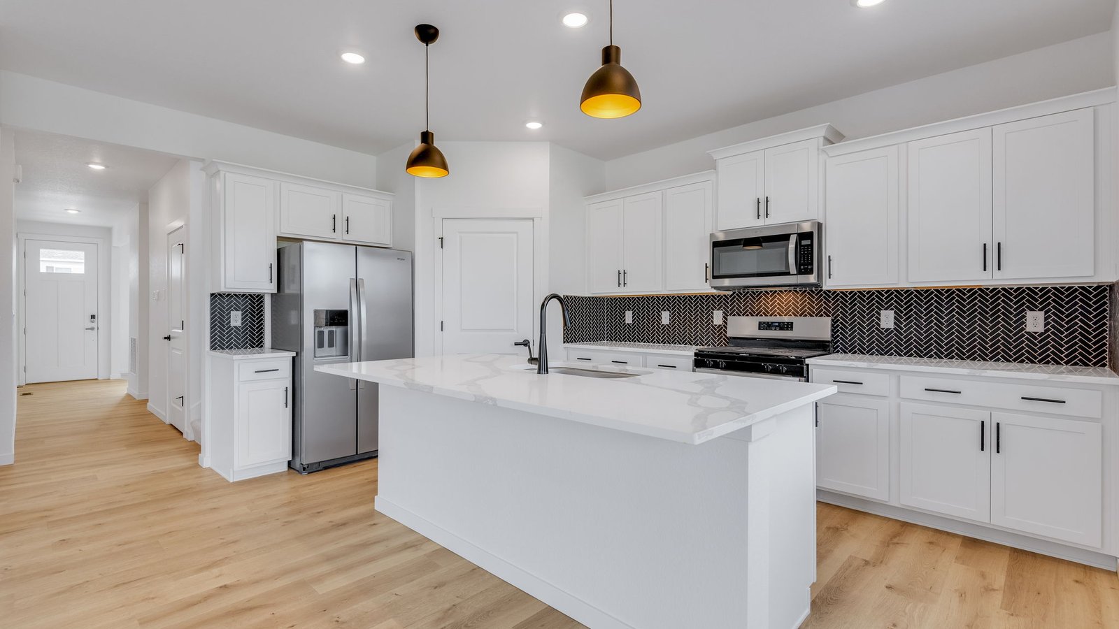 Spacious kitchen island perfect for entraining in new home at Trails at Crowfoot