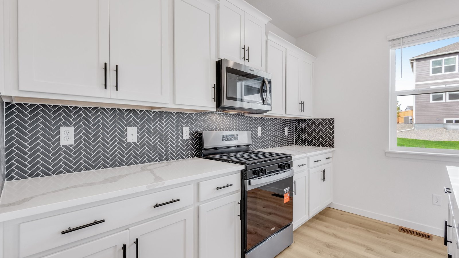 Spacious kitchen with new finishes at Trails at Crowfoot community