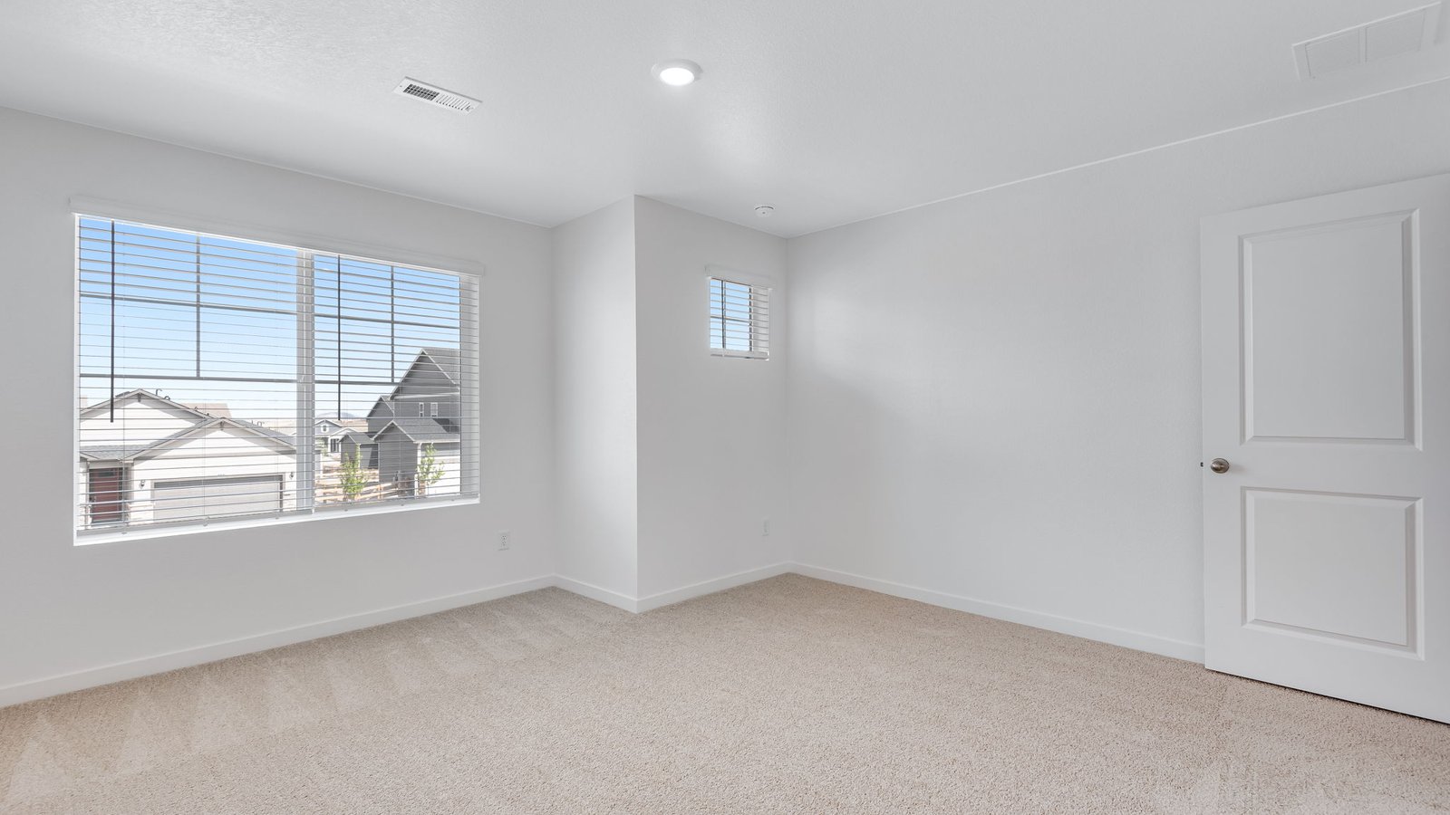 Owner’s suite retreat with generous layout and walk-in closet.