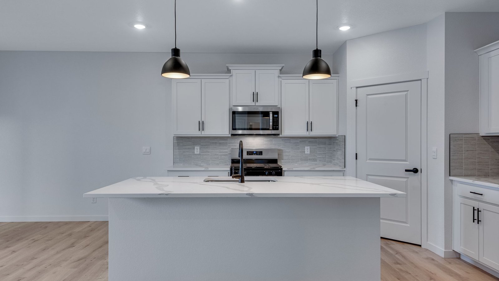 Kitchen island perfect for entertaining in new home in Parker Colorado
