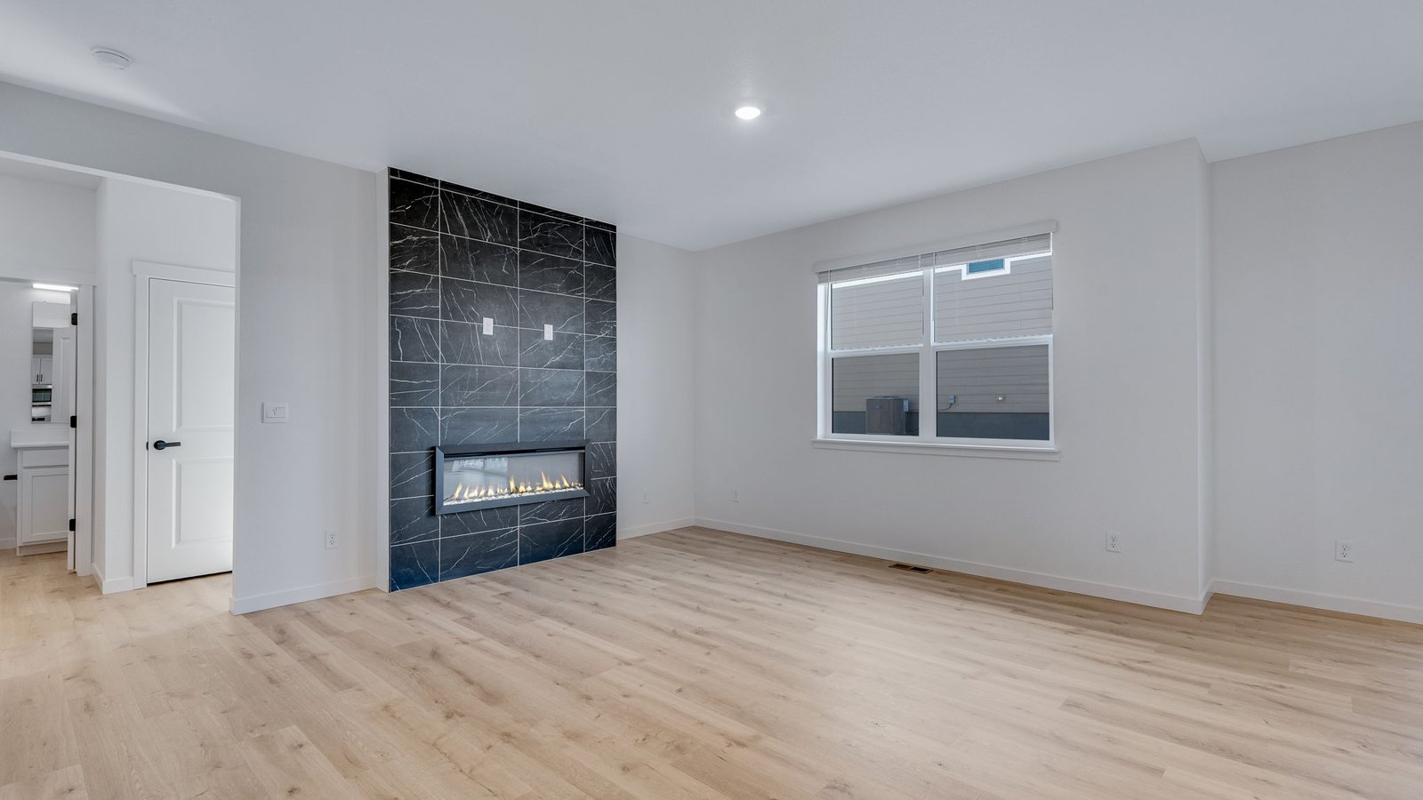 Fireplace in open concept layout of new home in Parker Colorado