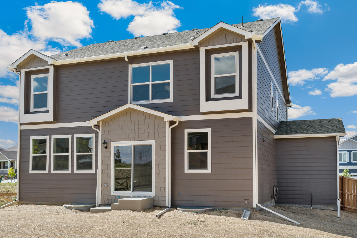 Rear exterior of Bridgeport 3-car model home