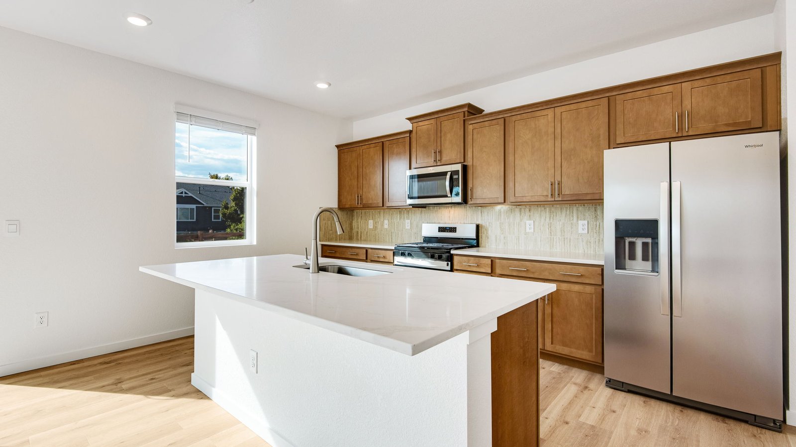 Kitchen with wood cabinets in new home