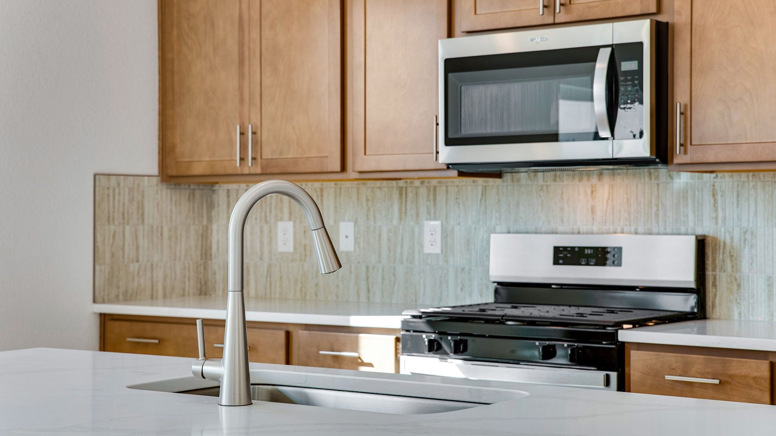 brown cabinets and blackfixtures in new parker, co home