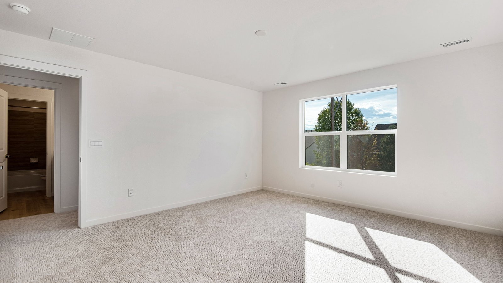 primary bedroom in new home by D.R. hortno