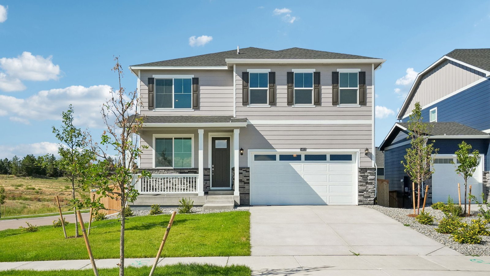 Exterior of new to story Bridgeport floor plan in Trails at Crowfoot