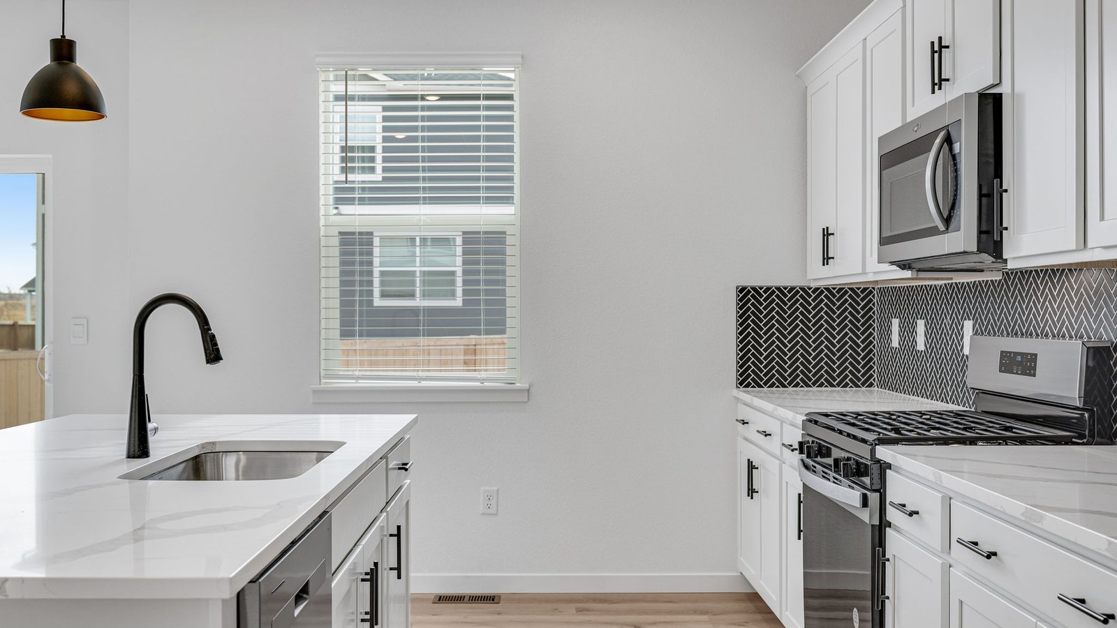 kitchen with black faucet in new construction home parker, co